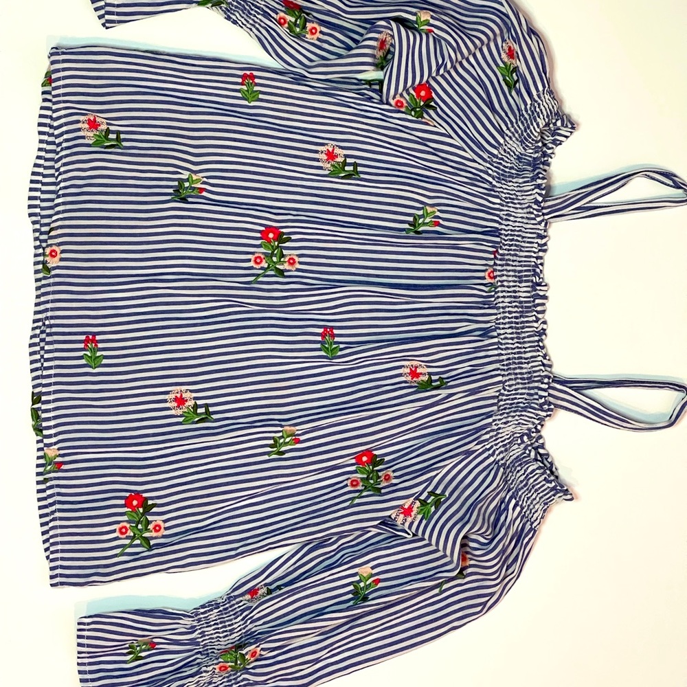Cute long sleeve off the shoulder with straps.